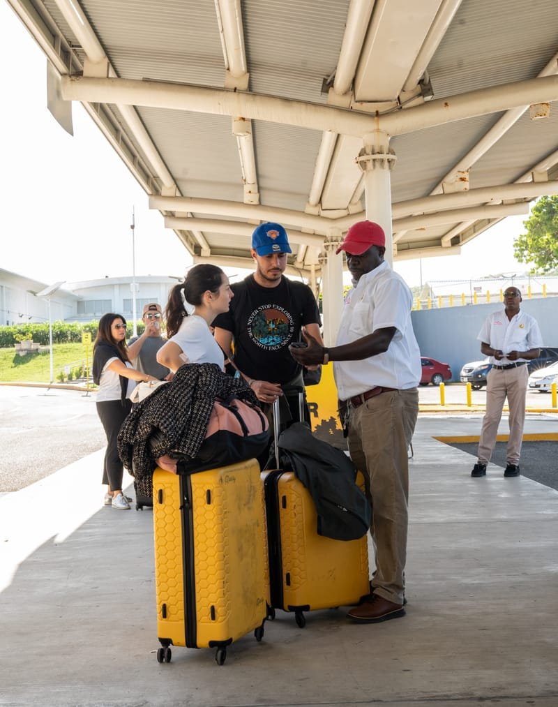Driver greeting passengers at the taxi dispatch